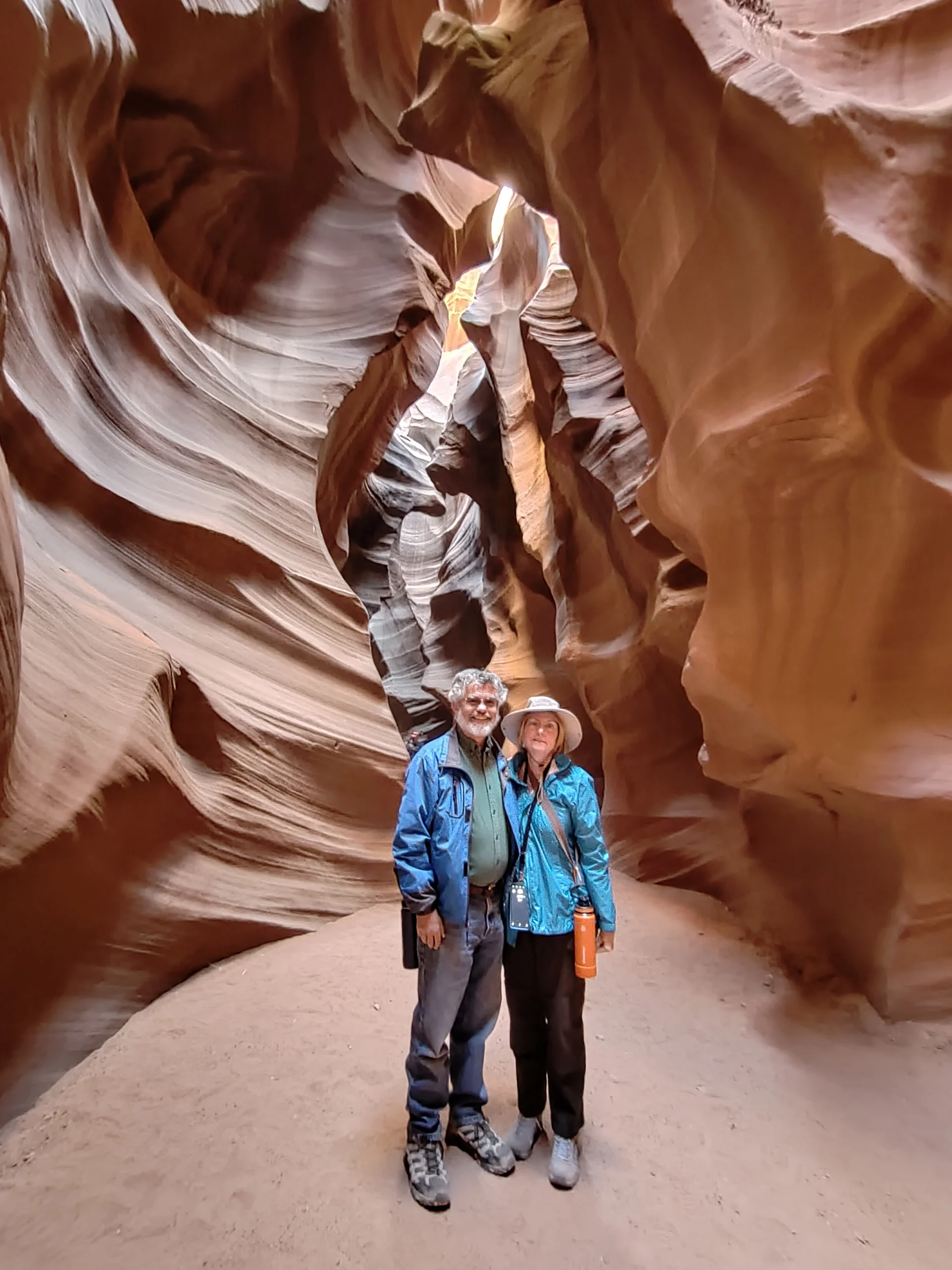 A couple poses inside a cave