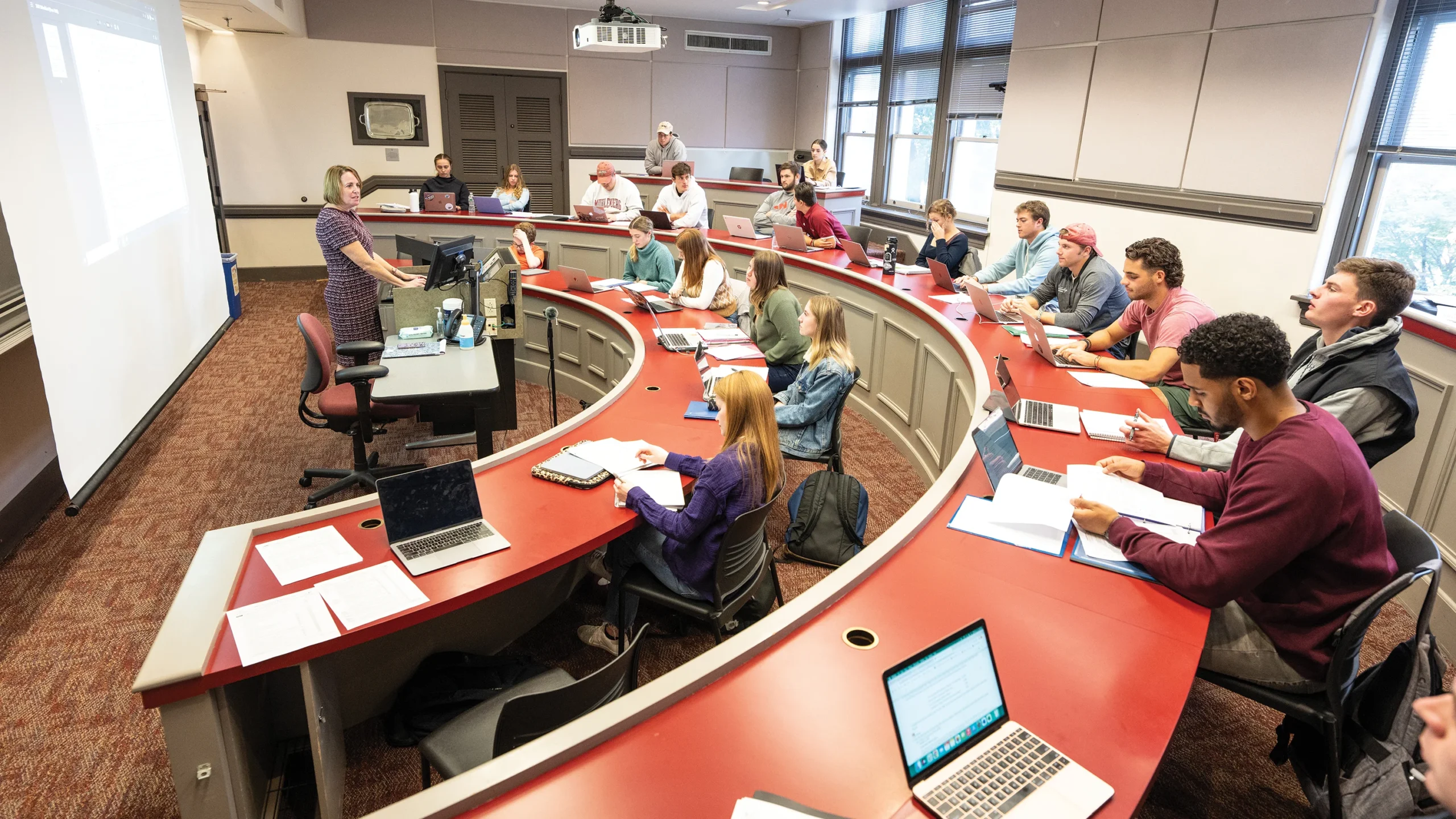 Photo of Assistant Professor of Accounting Ellen Rackas in front of the class teaching.