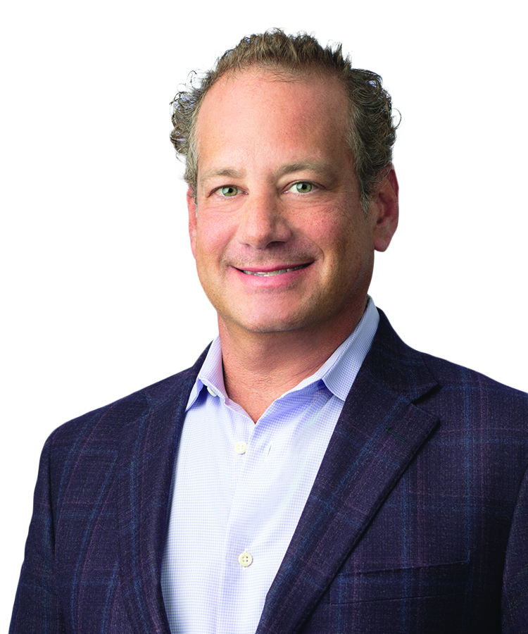 A headshot of a man in a suit