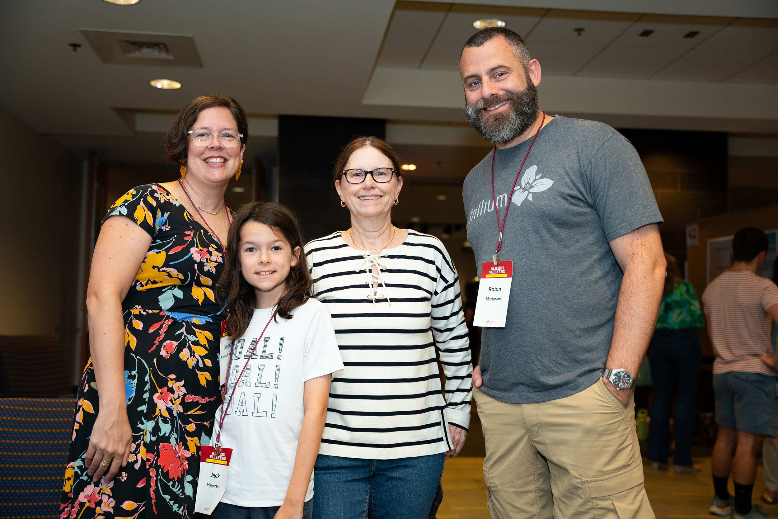 Four people pose for a photo inside Seegers Union