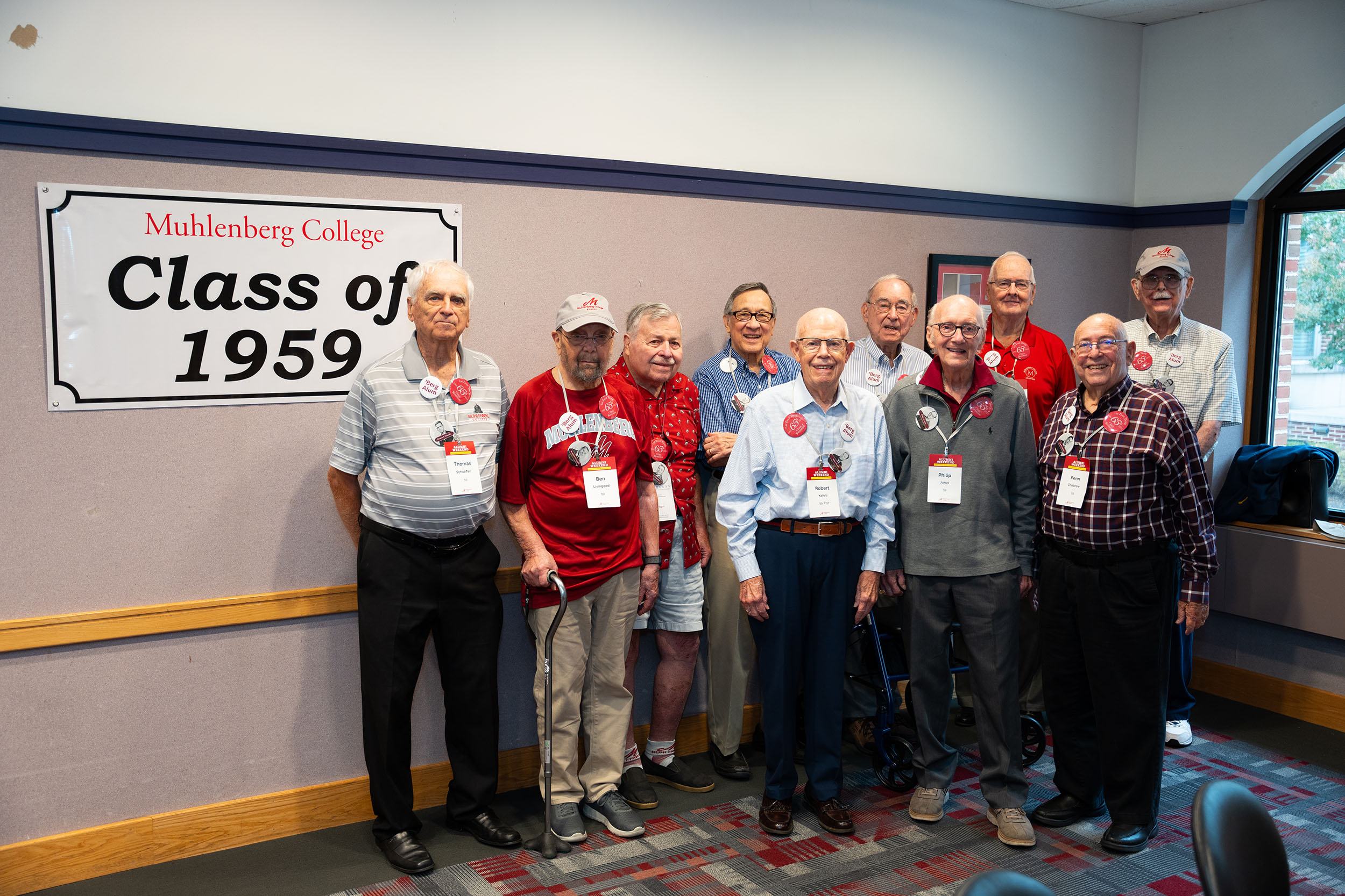 A group of men in front of a sign that says Muhlenberg College Class of 1959