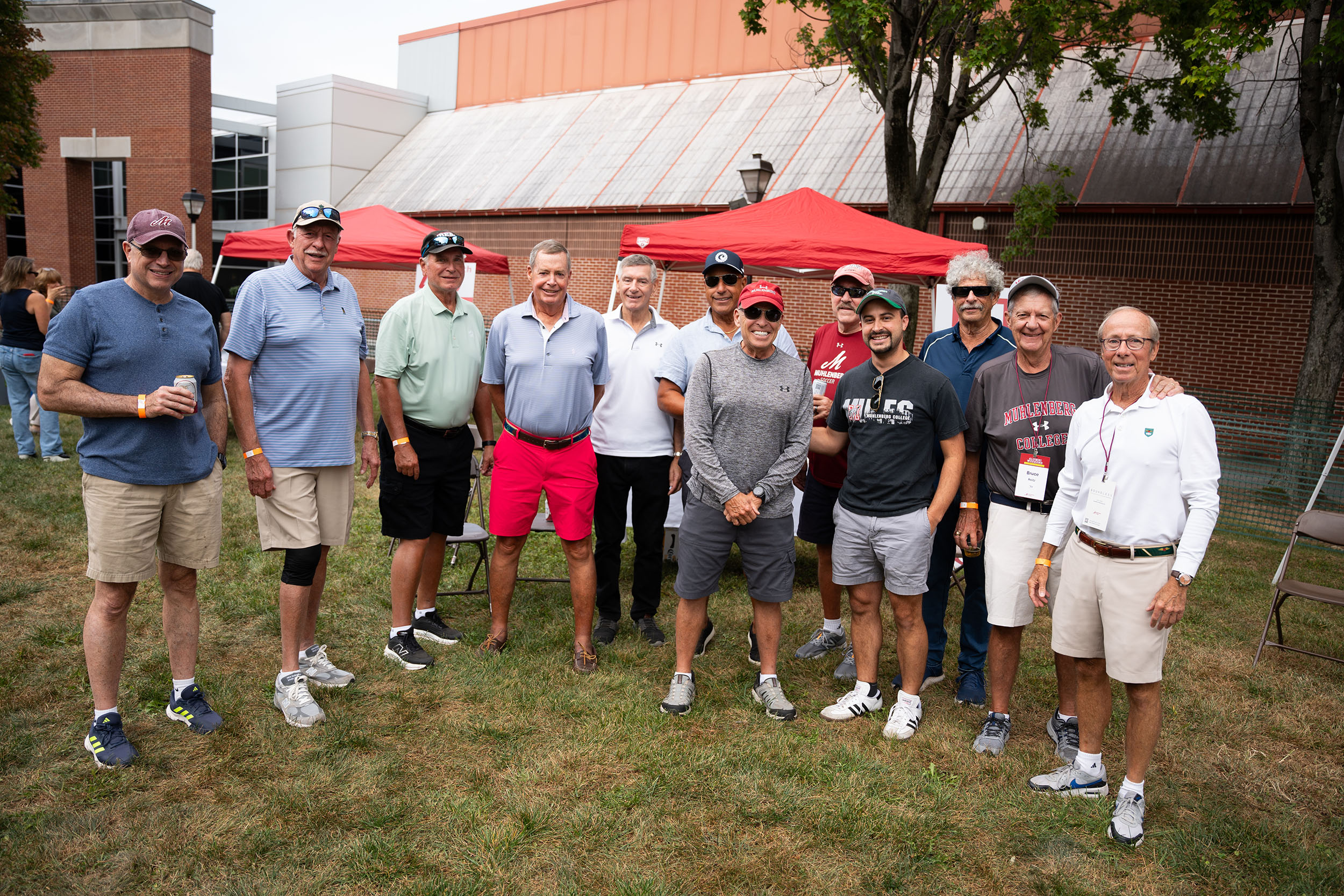 A large group of men at a tailgate