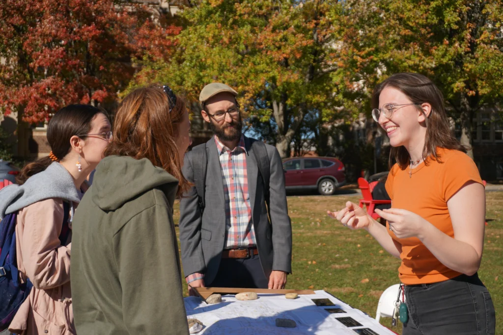 Maddie Davidson speaking with other students outside