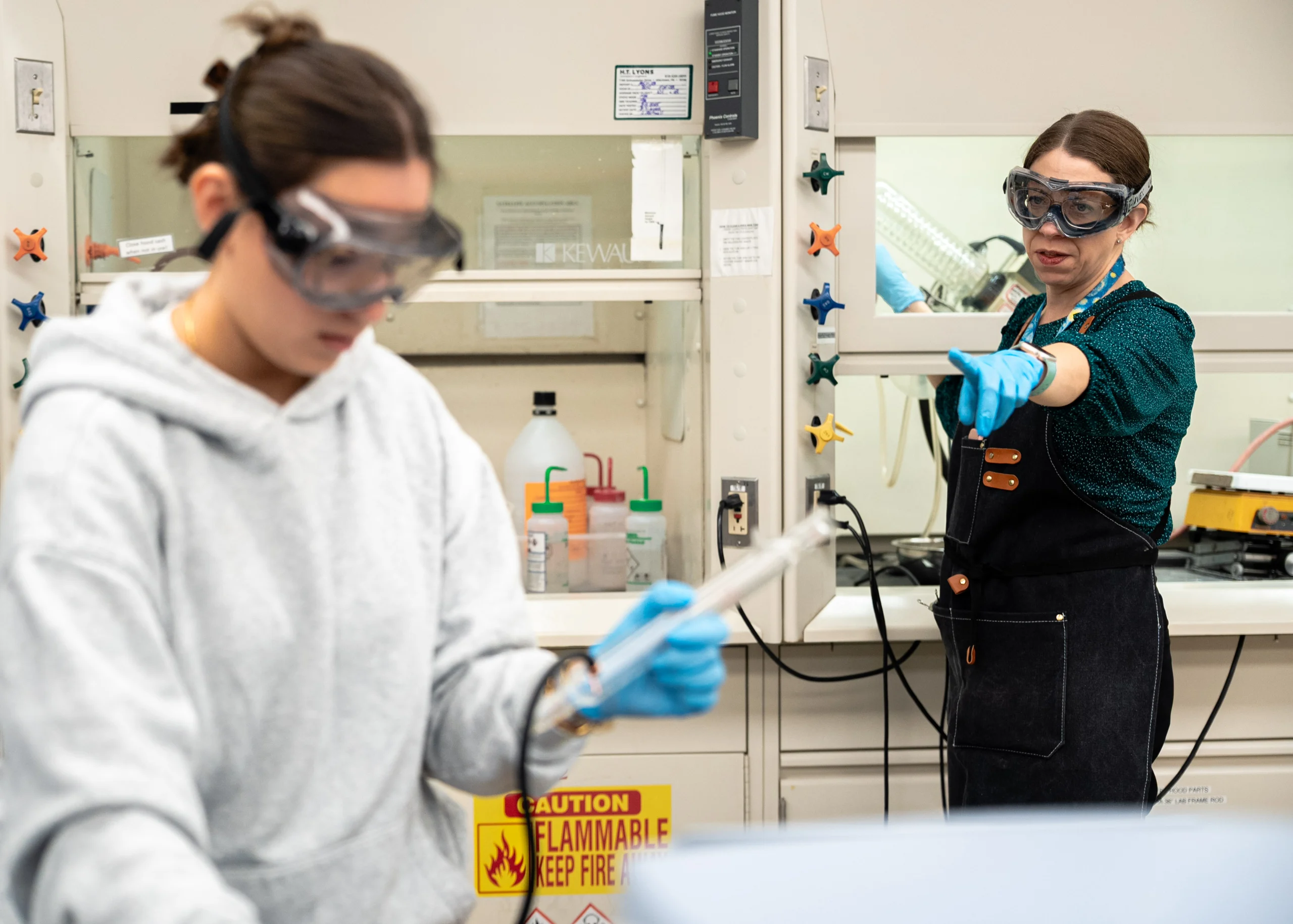 Keri Colabroy directing a student during a lab